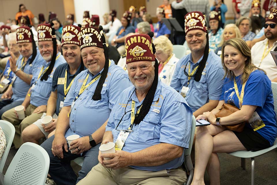 large group of seated Shriners and ladies