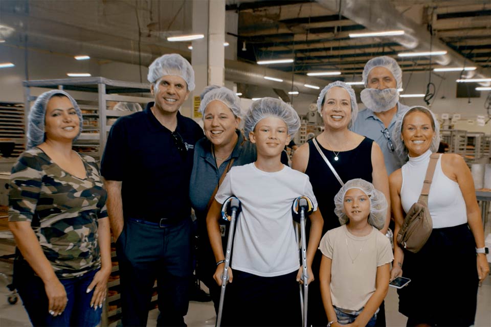 Dunkin workers, patients, volunteers, all wearing hair nets at Dunkin location