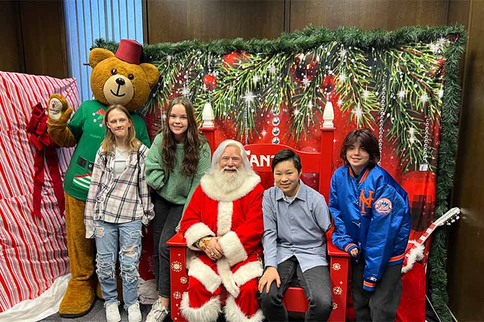 Fezzy with patients and Santa.