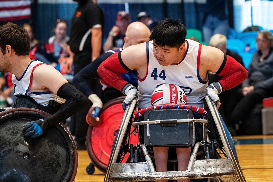 Zion in wheelchair on court during competition