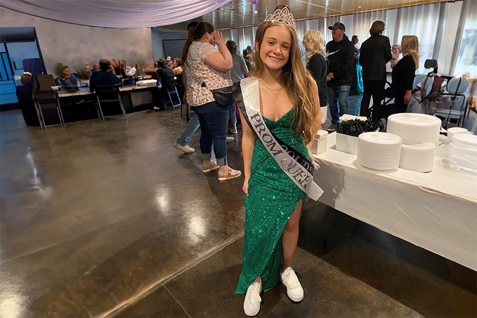 Jennessa wearing prom dress and white sneakers