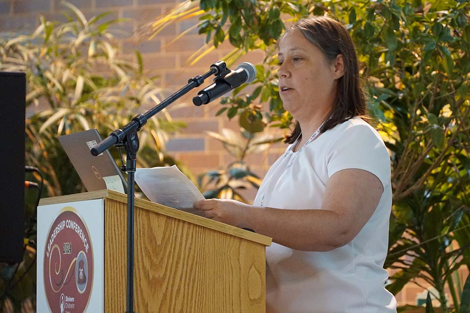 cerebral patient Peggy speaking at podium