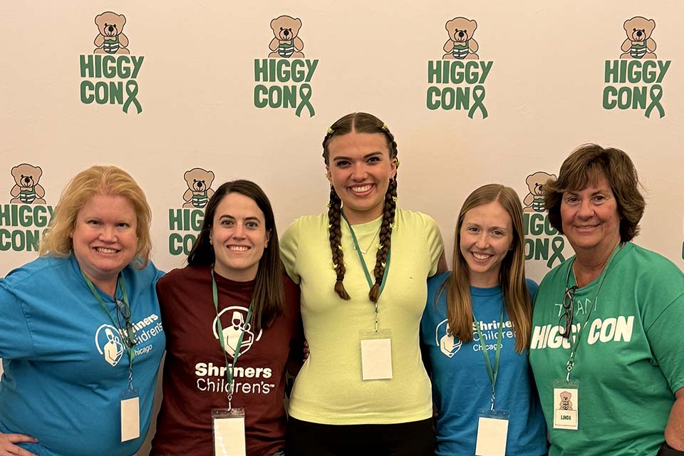 five female attendees of scoliosis conference