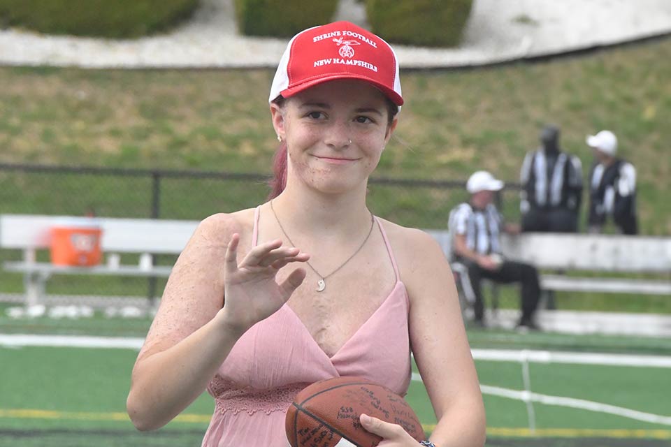 burn patient Nevaeh holding football