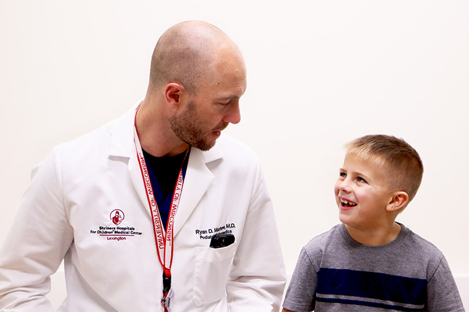 Physician smiling at patient